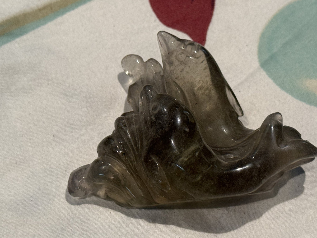 Libyan desert glass dolphin carving