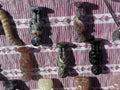 Mixed stone alien figure carvings