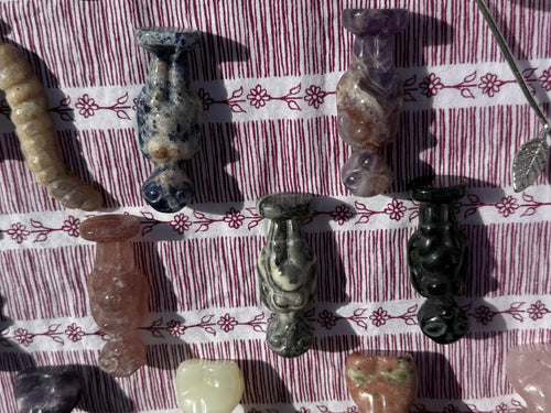 Mixed stone alien figure carvings