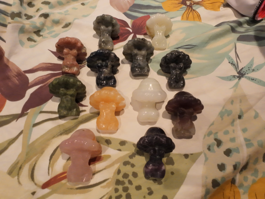 Mushroom people carvings group