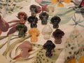 Mushroom people carvings group