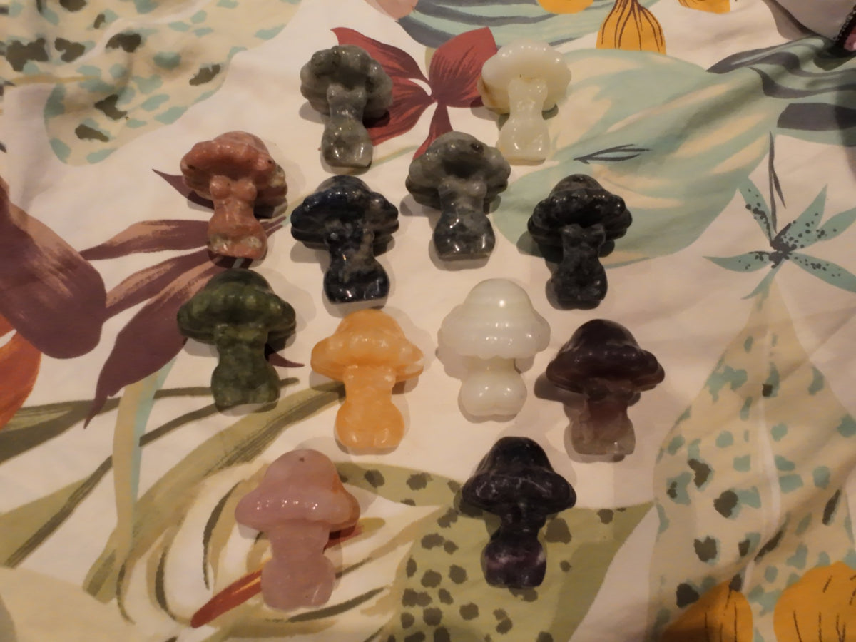 Mushroom people carvings spread